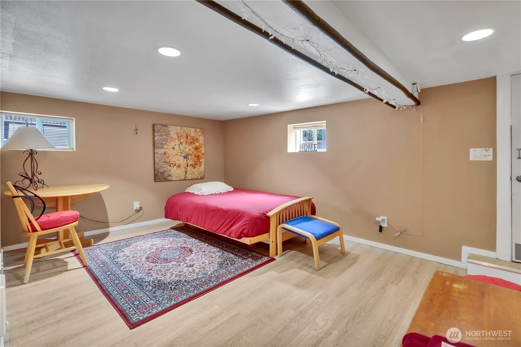 2307 Southwest Myrtle Street Seattle, WA 98106 - Photo 18 of 30 a bedroom with a bed and wooden floor