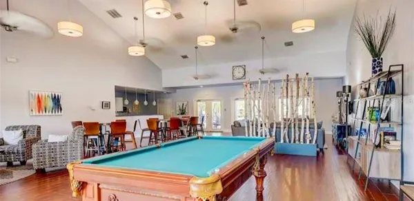 a living room with lots of furniture and a chandelier