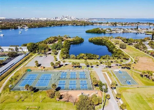 an aerial view of lake residential houses with outdoor space and seating