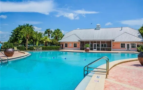 an aerial view of a house with swimming pool garden view and a yard