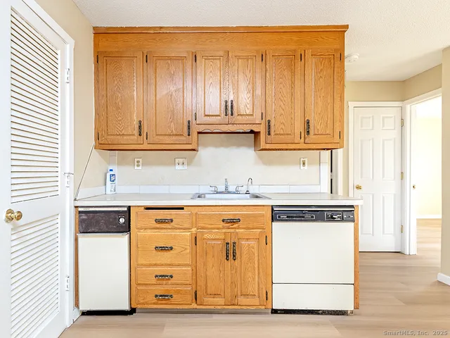 a kitchen with stainless steel appliances granite countertop a stove and a refrigerator