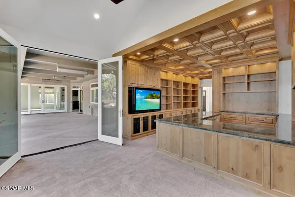 a kitchen with sink and refrigerator