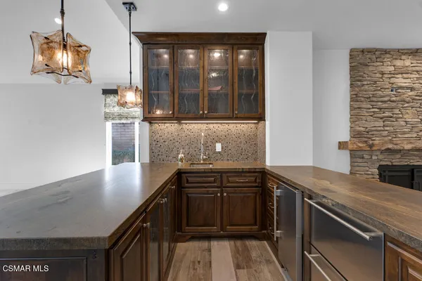 a kitchen that has a sink and a stove