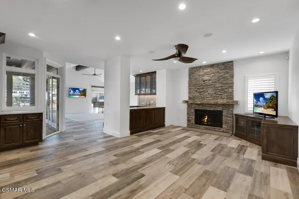 a living room with furniture and a fireplace