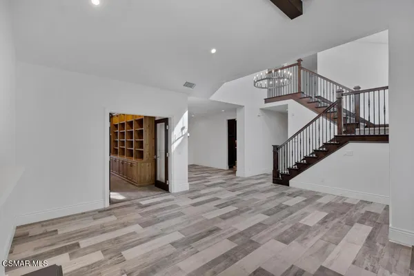 a view of entryway with wooden floor