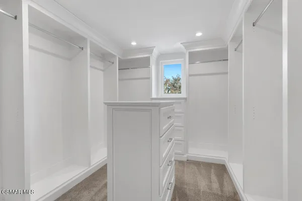 a bathroom with a shower and a sink