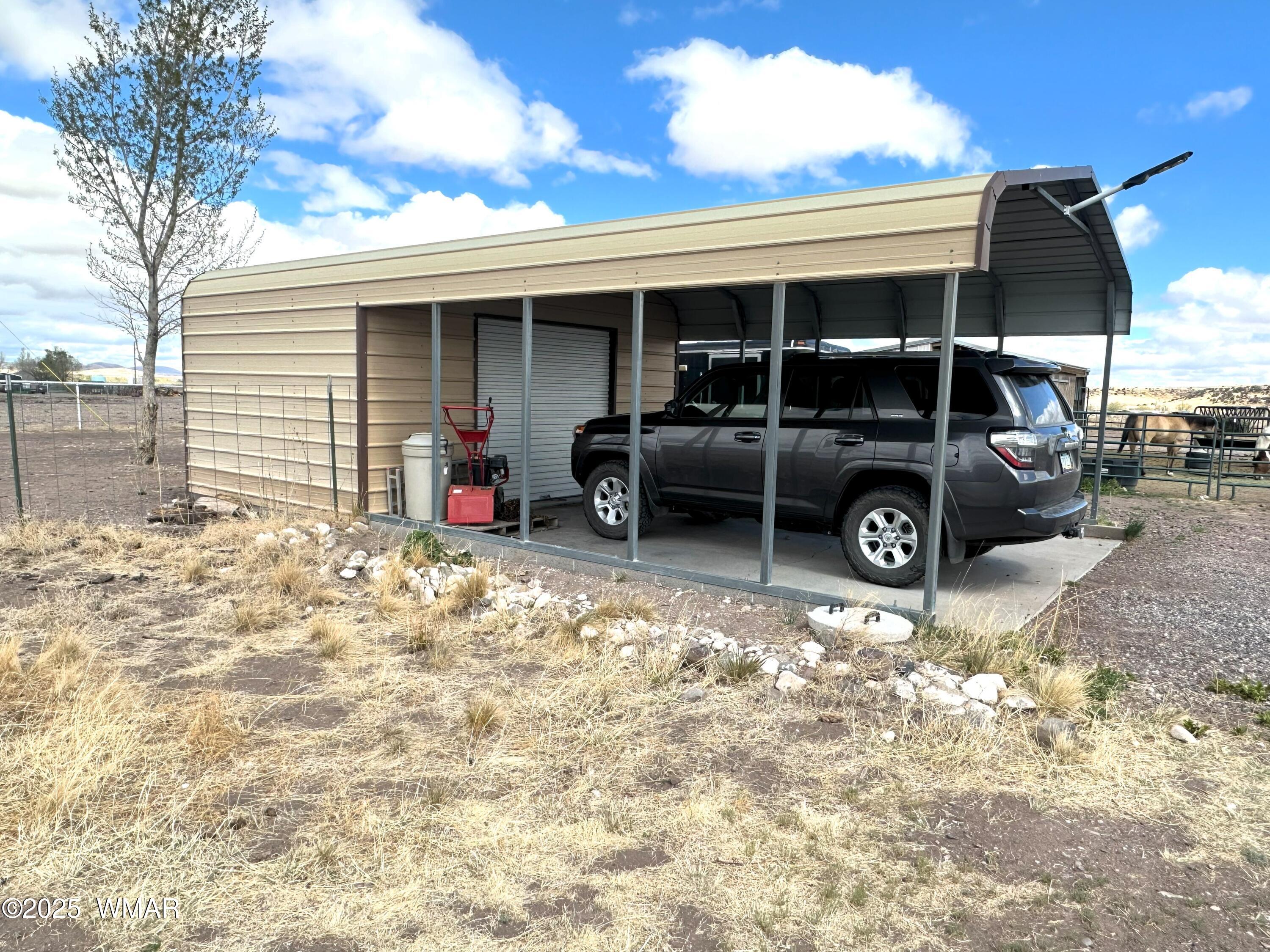 7 County Road Springerville, AZ 85938 - Photo 49 of 56 18x31 COVERED CARPORT WITH 12' SECURED STORAGE AREA