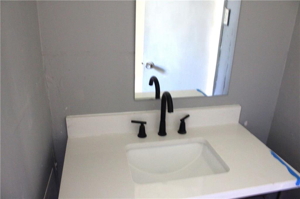 1189 Hartley Street Macon, GA 31206 - Photo 3 of 9 a bathroom with a sink