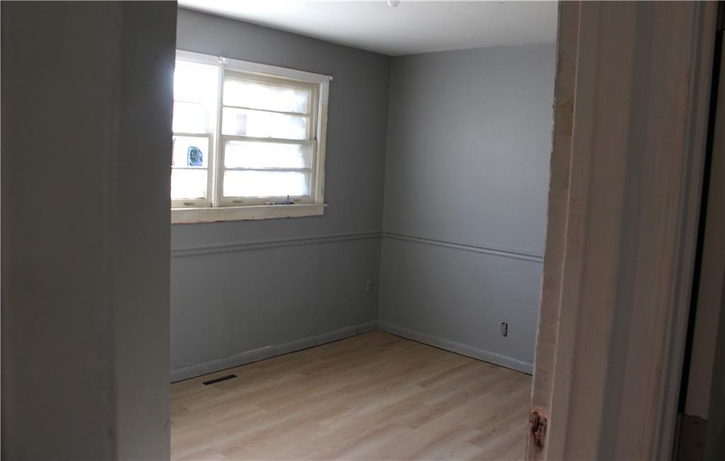 1189 Hartley Street Macon, GA 31206 - Photo 8 of 9 an empty room with a window