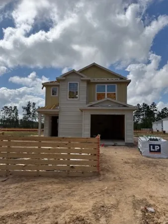 a kitchen with stainless steel appliances granite countertop a stove a sink a refrigerator a dining table and chairs with wooden floor