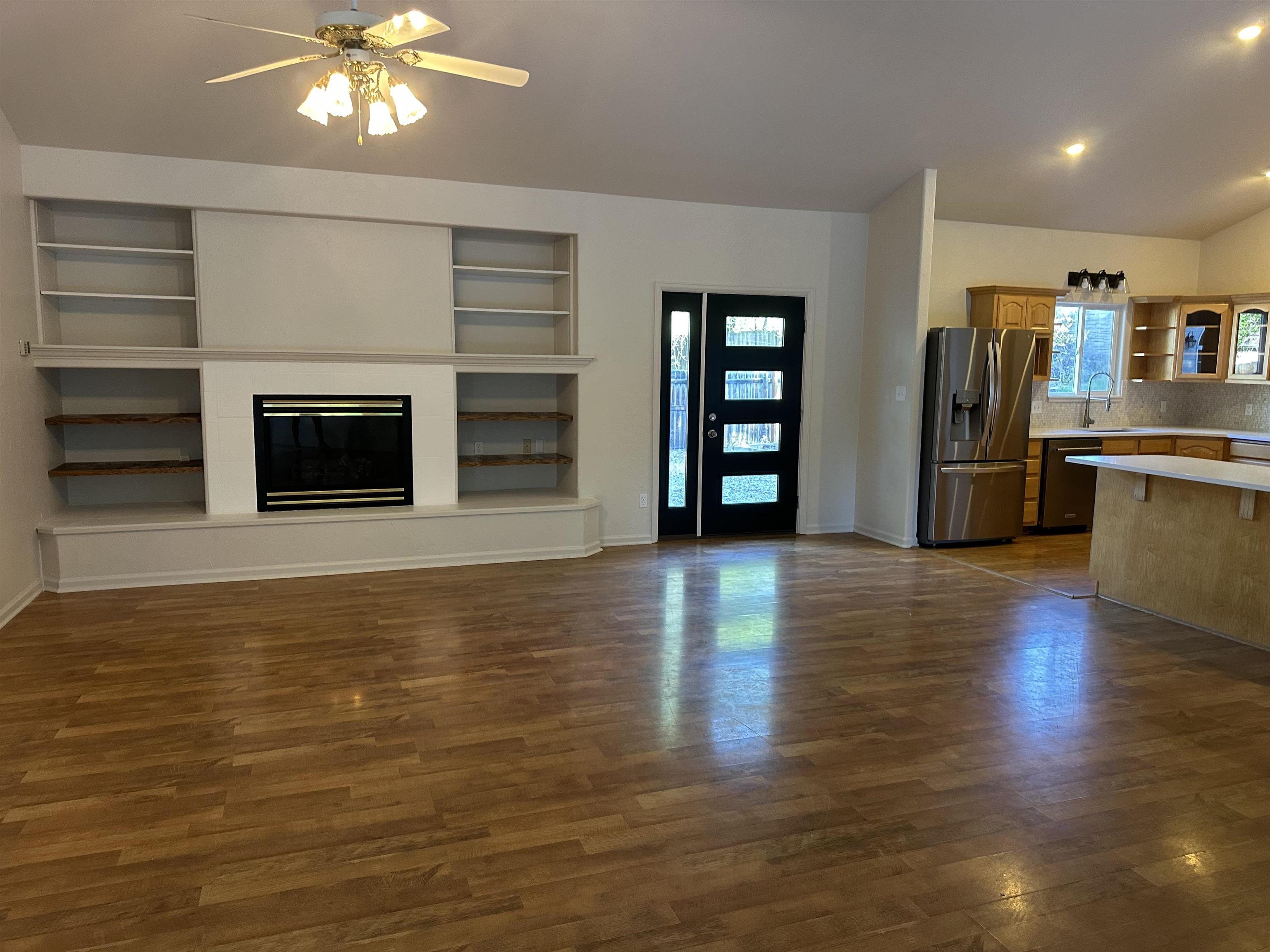 2678 Cambridge Road Grand Junction, CO 81506 - Photo 12 of 32 a view of a livingroom with furniture hardwood floor and a ceiling fan