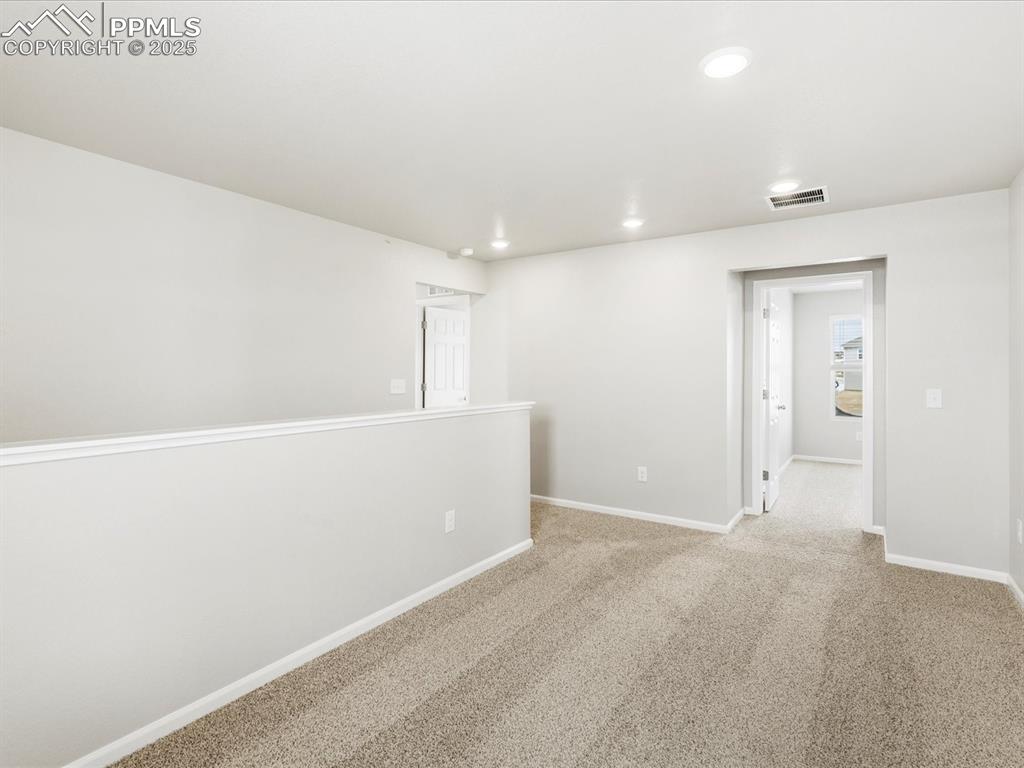 10636 Waterloo Drive Peyton, CO 80831 - Photo 19 of 36 Carpeted empty room with recessed lighting, visible vents, and baseboards