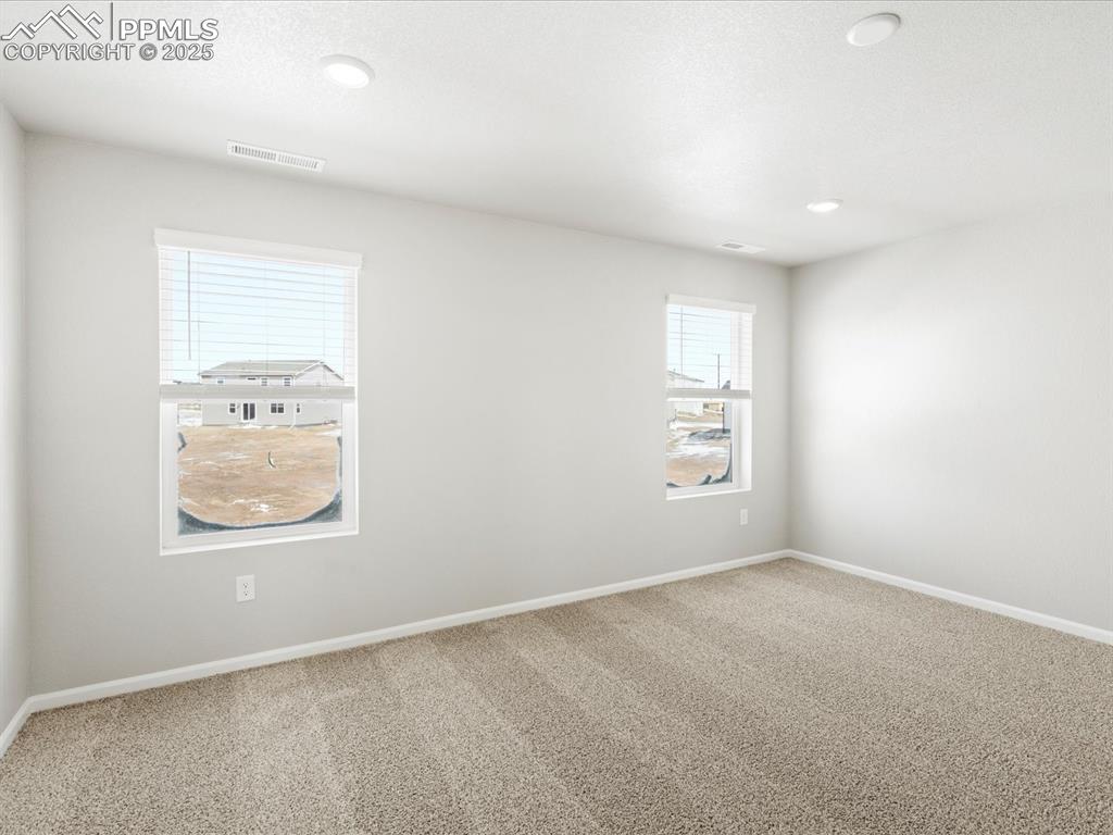 10636 Waterloo Drive Peyton, CO 80831 - Photo 20 of 36 Carpeted empty room featuring recessed lighting, baseboards, and visible vents