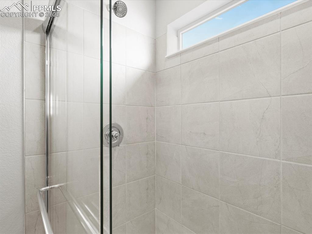 10636 Waterloo Drive Peyton, CO 80831 - Photo 26 of 36 Full bathroom with a tile shower