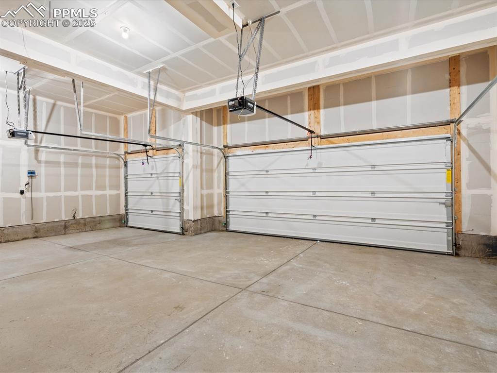 10636 Waterloo Drive Peyton, CO 80831 - Photo 36 of 36 Garage featuring a garage door opener