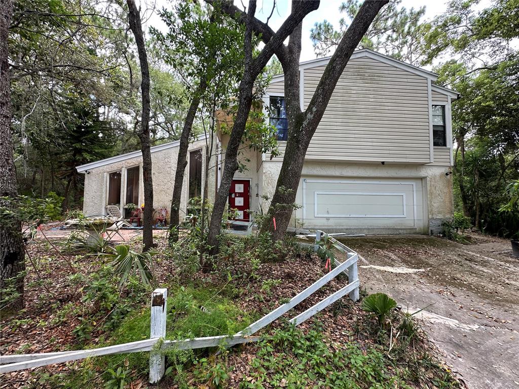 559 South Country Club Road Lake Mary, FL 32746 - Photo 1 of 1 a view of house with trees in the background