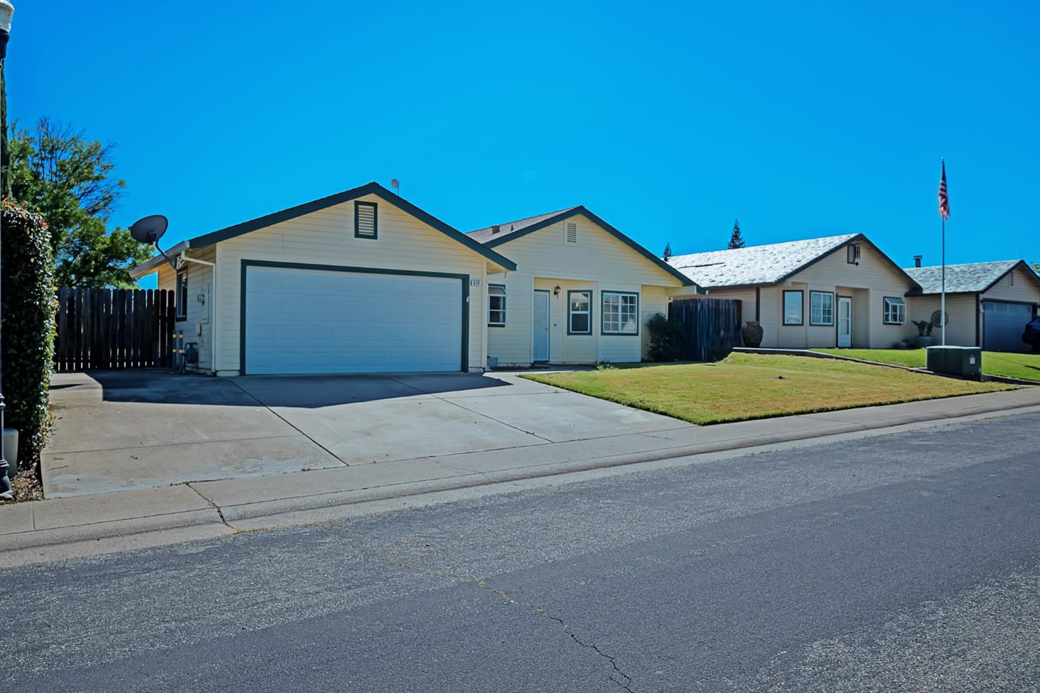 614 Brookview Court Ione, CA 95640 - Photo 2 of 24 a front view of a house with a yard and garage