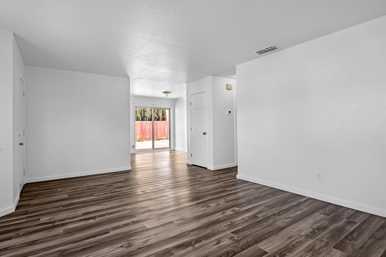 614 Brookview Court Ione, CA 95640 - Photo 4 of 24 a view of an empty room and wooden floor