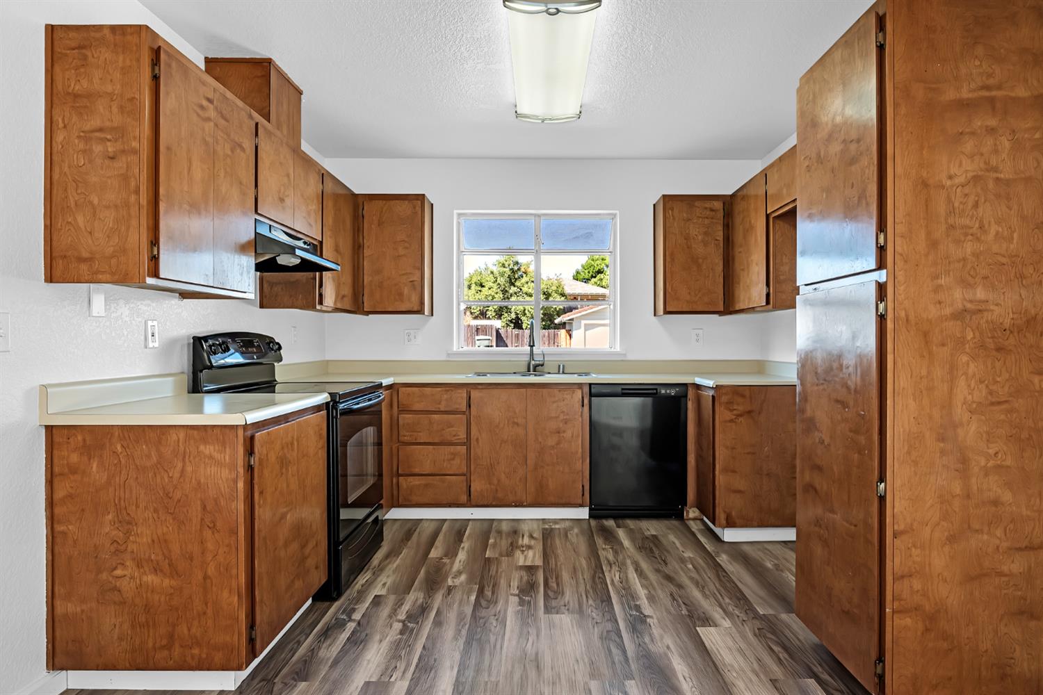 614 Brookview Court Ione, CA 95640 - Photo 7 of 24 a kitchen with stainless steel appliances granite countertop a sink and wooden cabinets