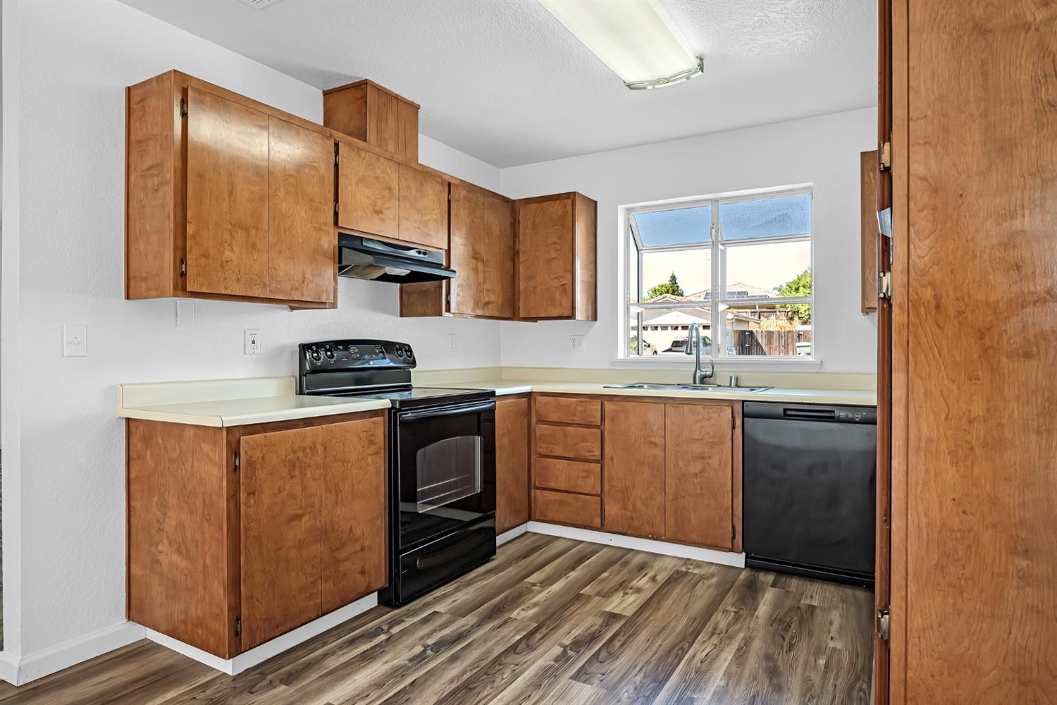 614 Brookview Court Ione, CA 95640 - Photo 8 of 24 a kitchen with stainless steel appliances granite countertop a stove a sink and a refrigerator