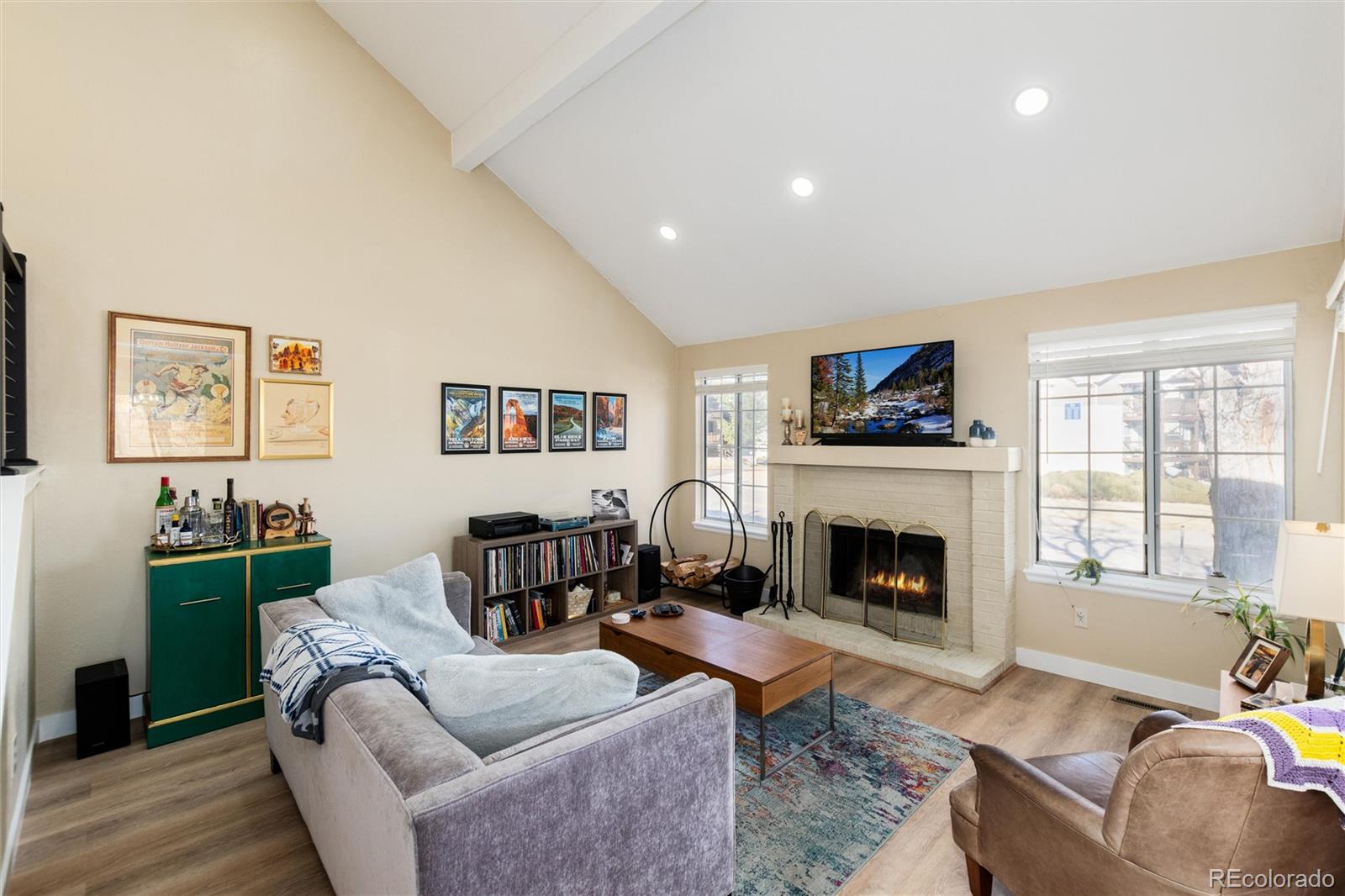4010 South Rifle Way Aurora, CO 80013 - Photo 11 of 45 a living room with furniture and a fireplace