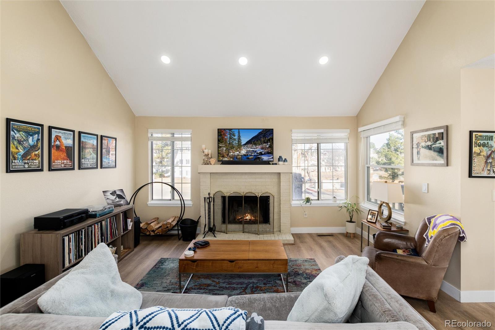 4010 South Rifle Way Aurora, CO 80013 - Photo 12 of 45 a living room with furniture or couch and a fireplace