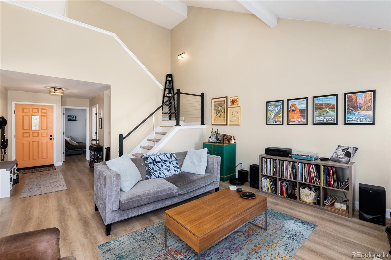 4010 South Rifle Way Aurora, CO 80013 - Photo 14 of 45 a living room with furniture and a book shelf