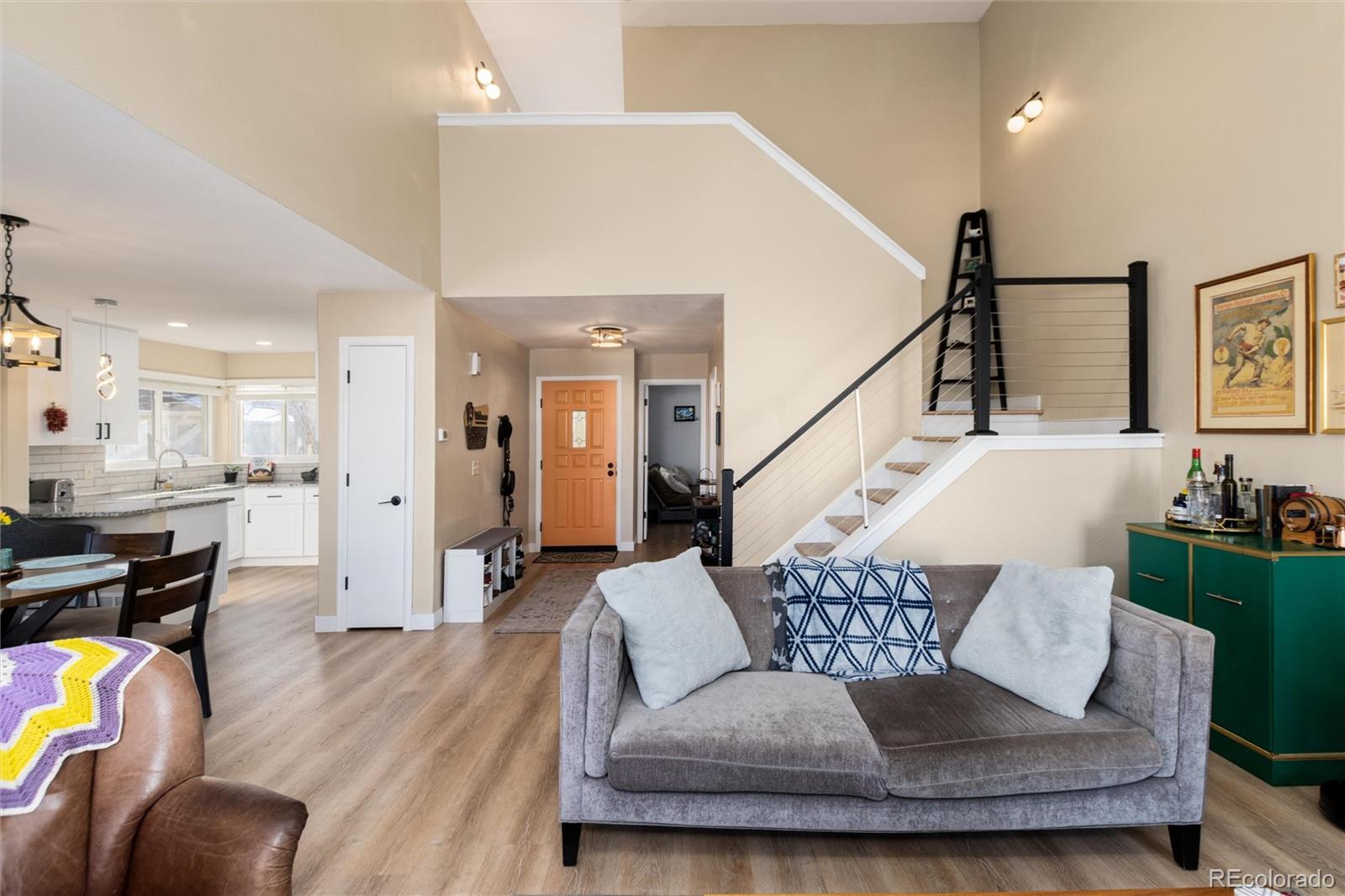 4010 South Rifle Way Aurora, CO 80013 - Photo 16 of 45 a living room with furniture and wooden floor