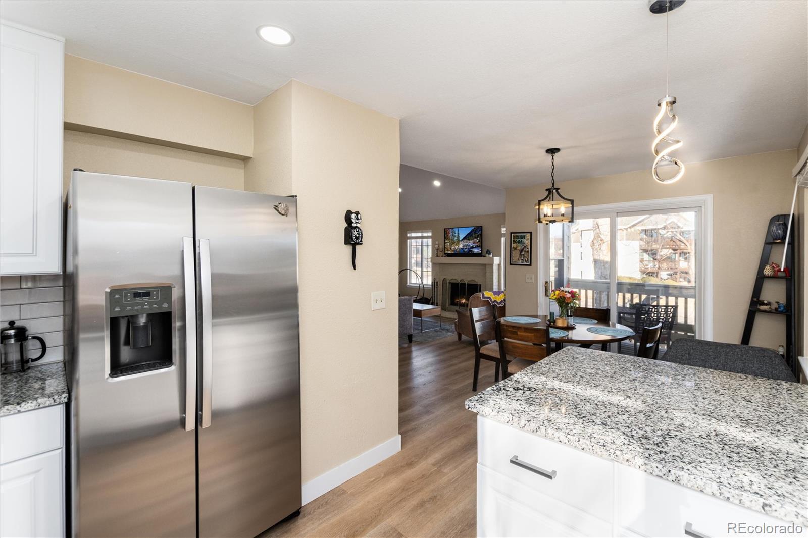 4010 South Rifle Way Aurora, CO 80013 - Photo 21 of 45 a kitchen with stainless steel appliances granite countertop a refrigerator and a sink