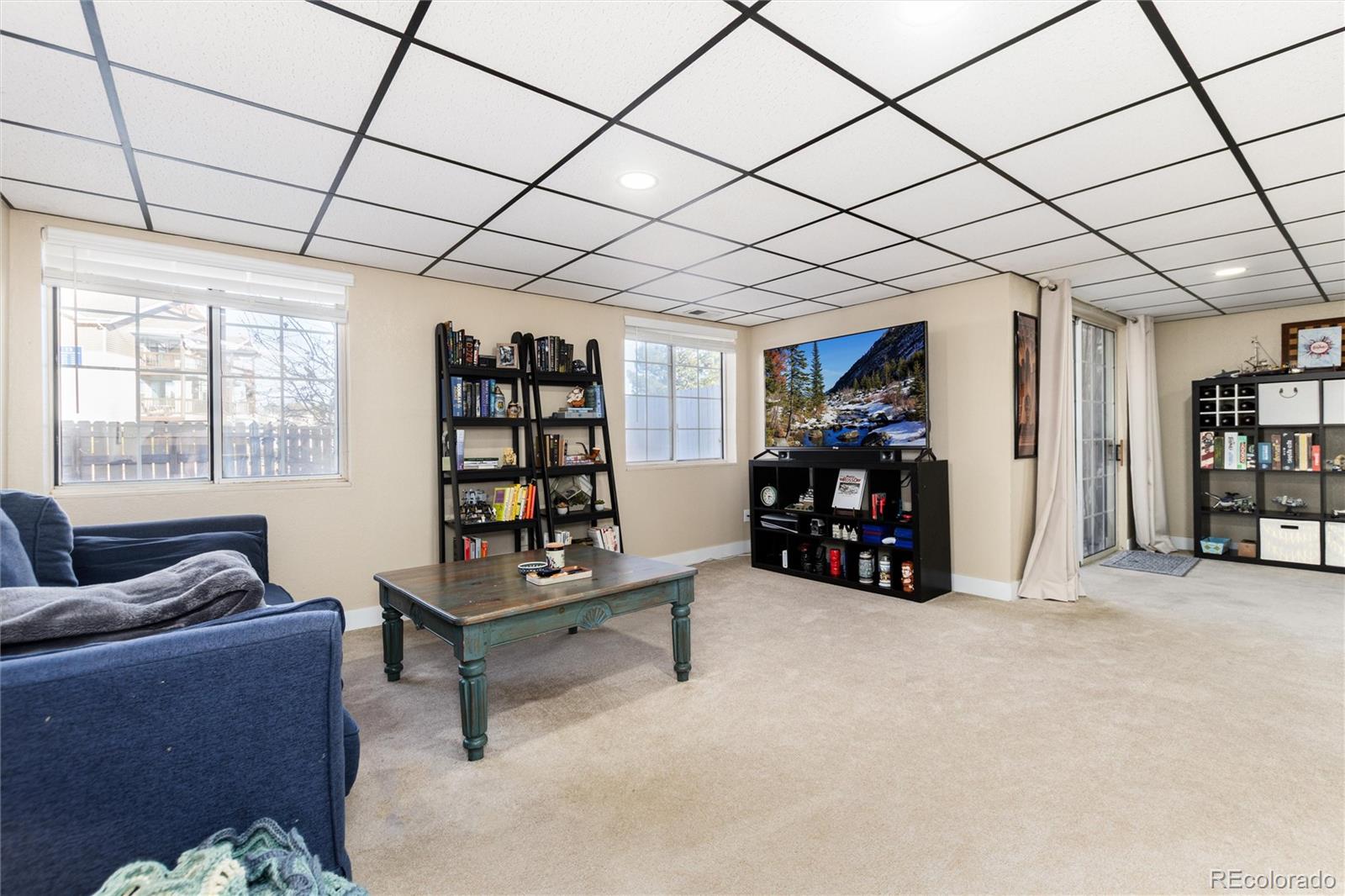 4010 South Rifle Way Aurora, CO 80013 - Photo 32 of 45 a living room with furniture and a couch