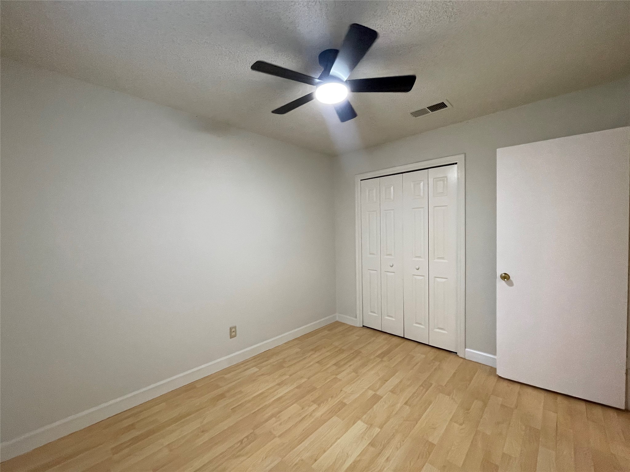 2031 Redwing Way Round Rock, TX 78664 - Photo 13 of 25 Hardwood floors and bright lighting create a welcoming and functional living space.