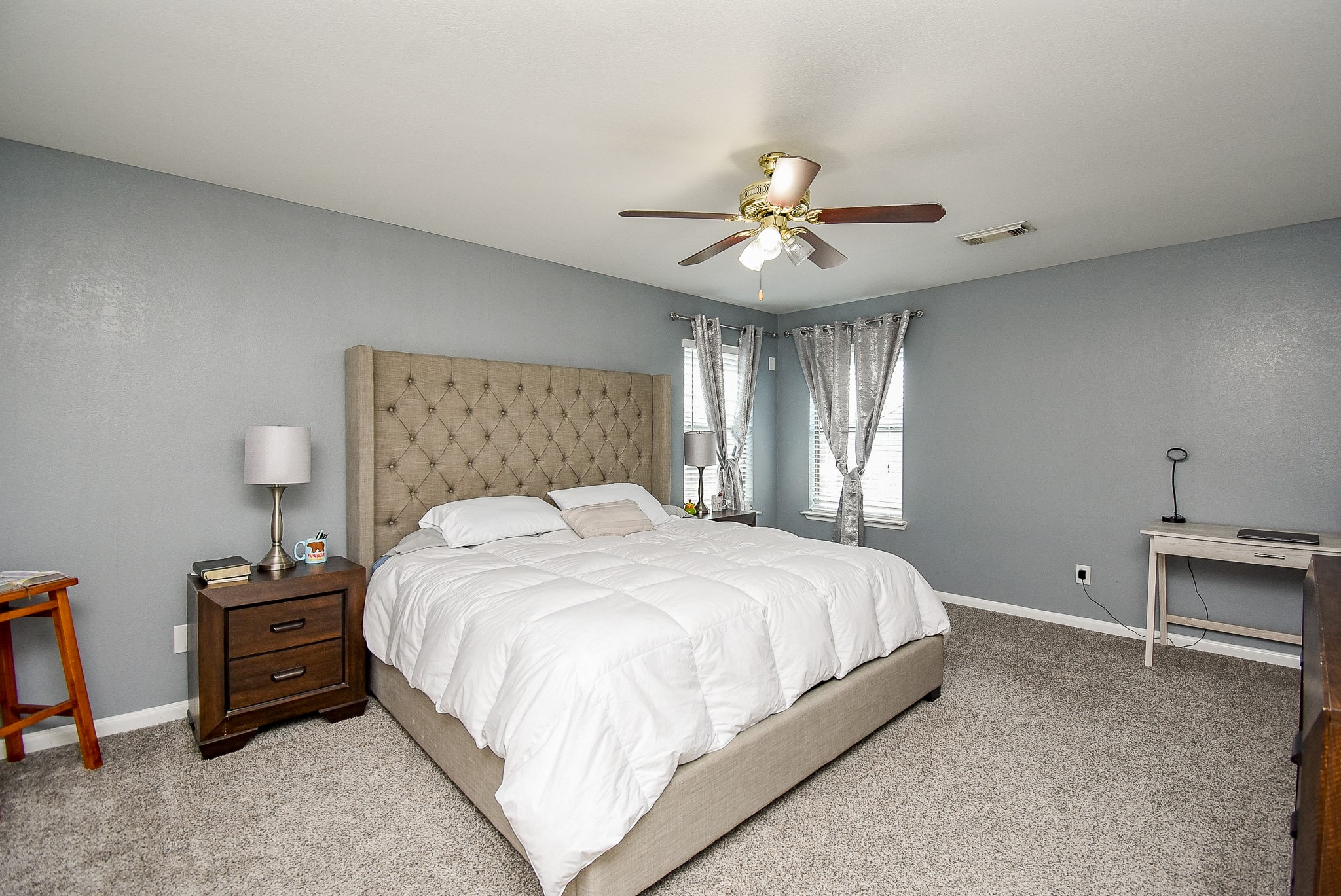 6111 Harvest Terrace Court Spring, TX 77379 - Photo 14 of 32 a large bedroom with a bed and a chandelier