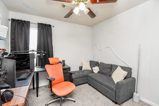 a bedroom with a bed and a tv