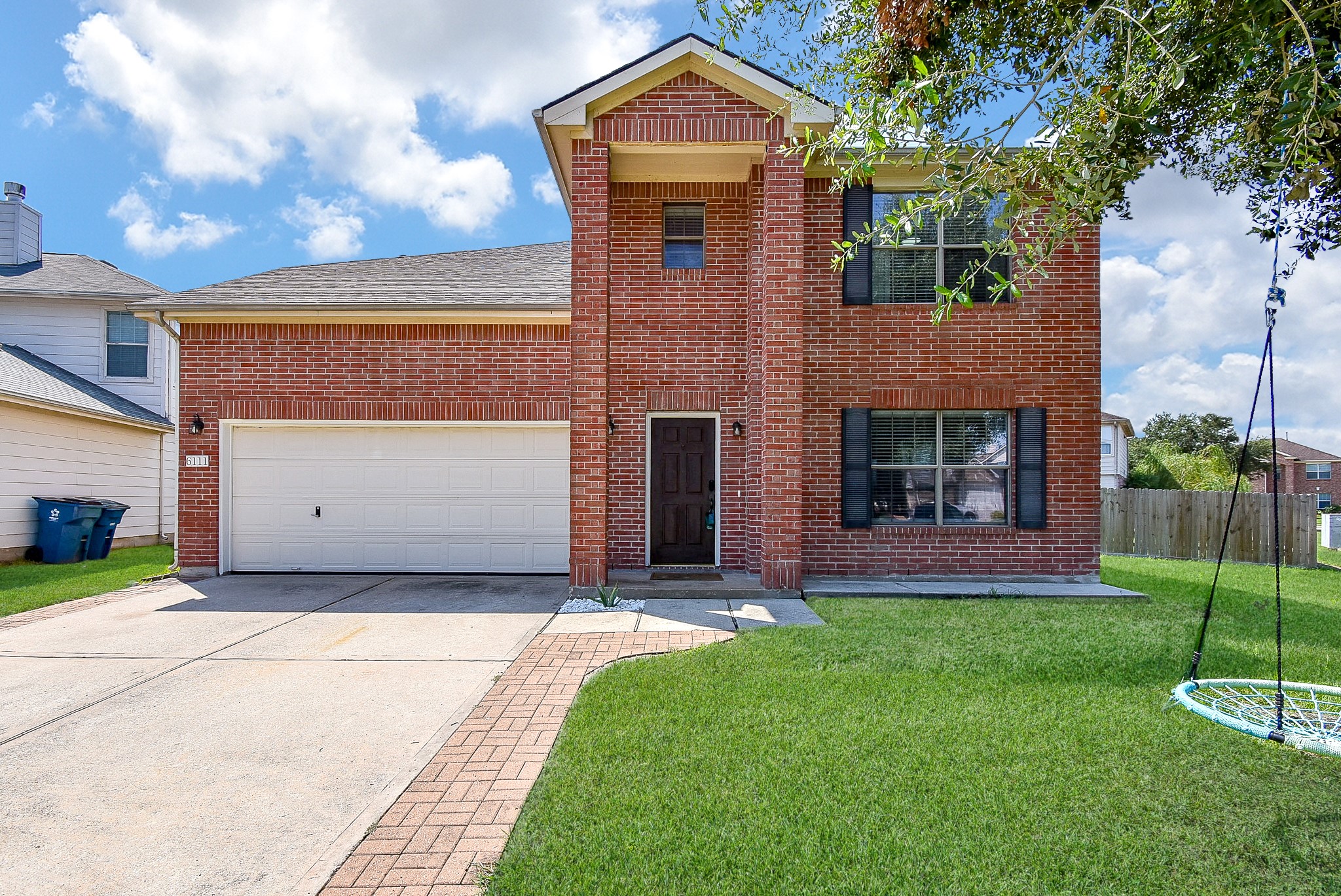 6111 Harvest Terrace Court Spring, TX 77379 - Photo 28 of 32 a front view of a house with a yard and garage