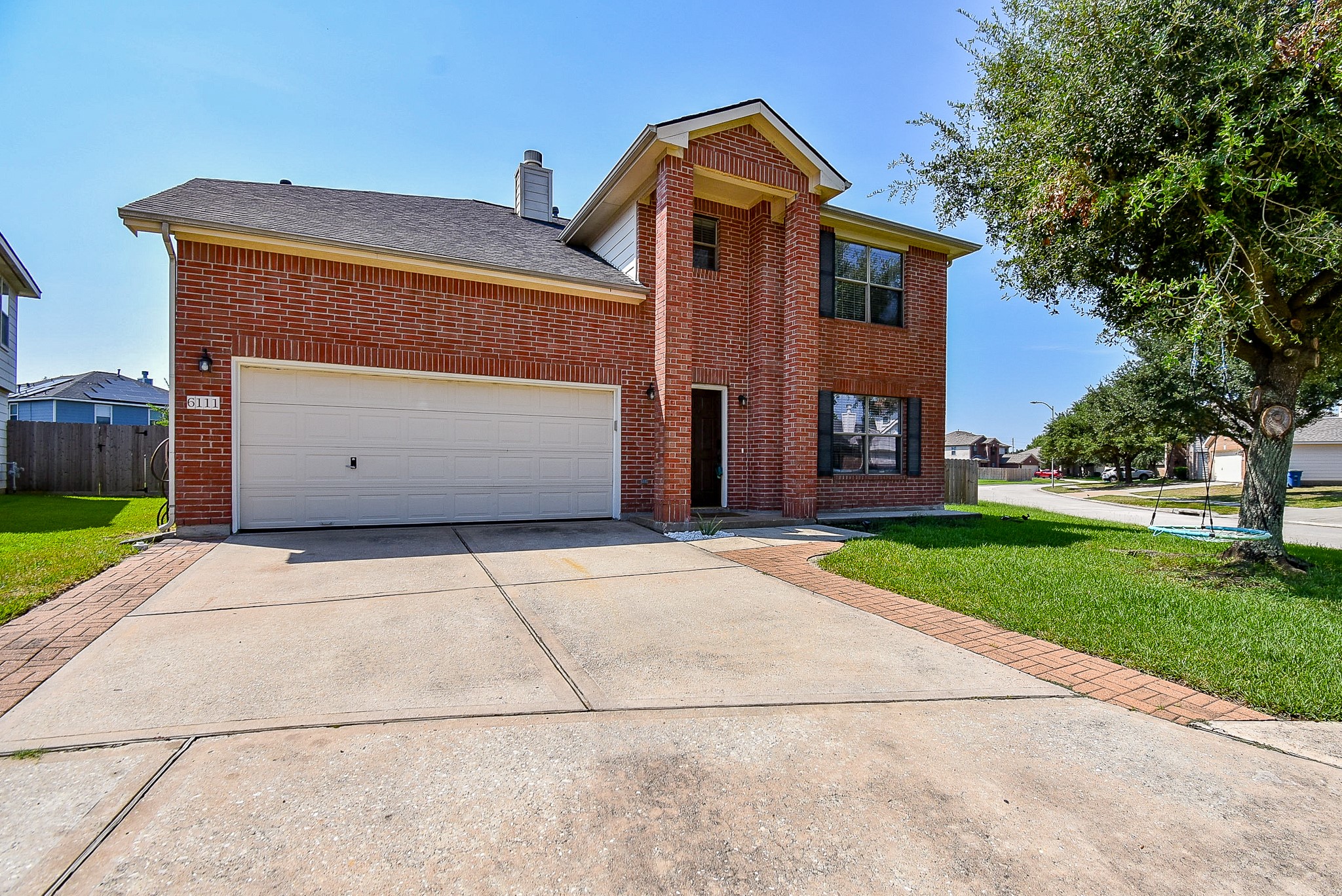6111 Harvest Terrace Court Spring, TX 77379 - Photo 32 of 32 a front view of a house with a yard and garage
