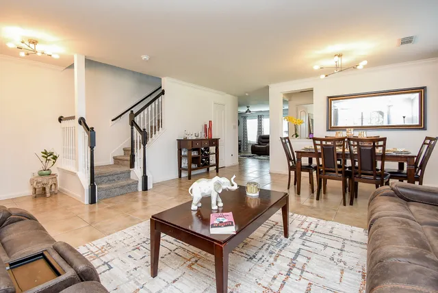 a view of a house with a yard and sitting area