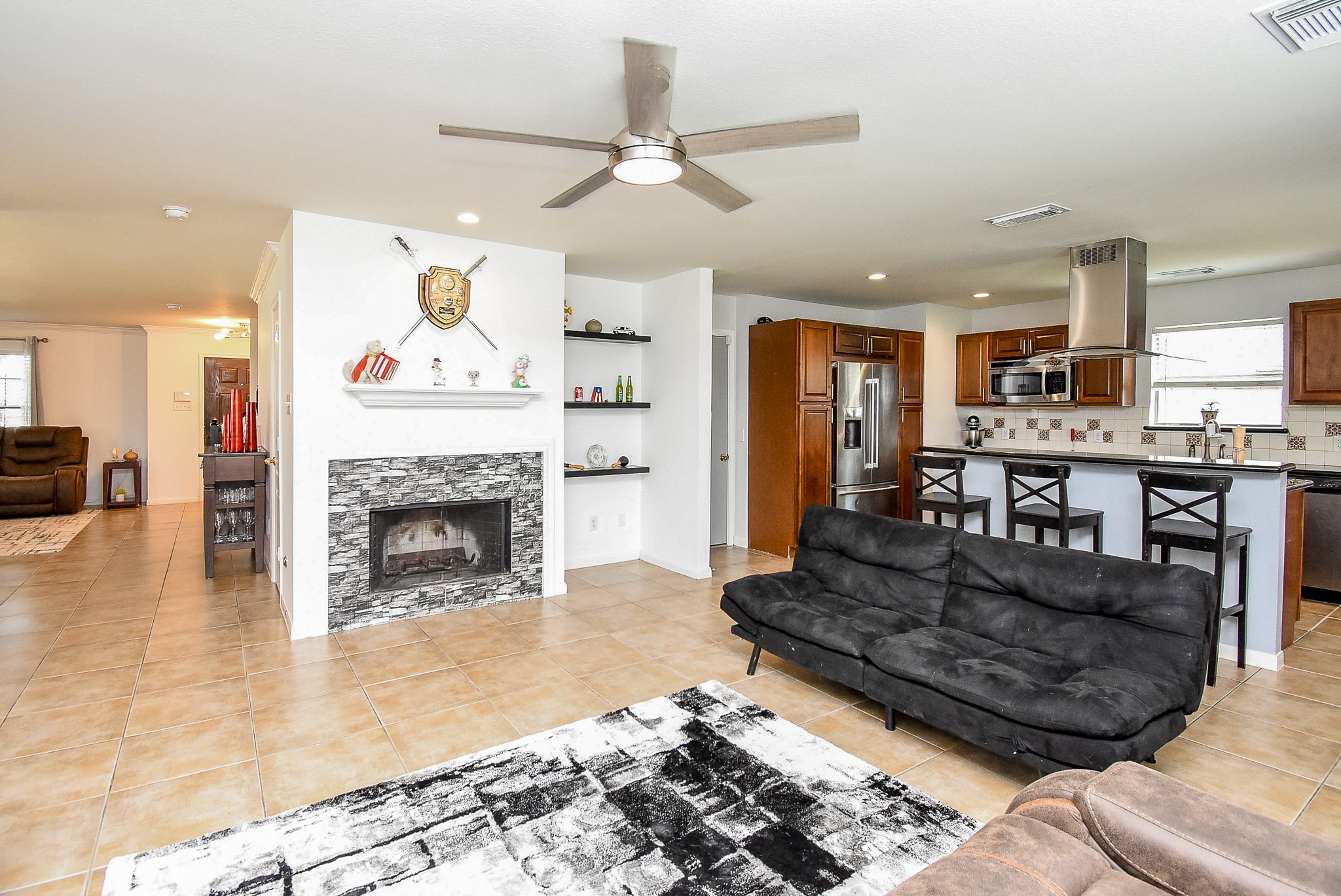 6111 Harvest Terrace Court Spring, TX 77379 - Photo 8 of 32 a living room with furniture and a fireplace