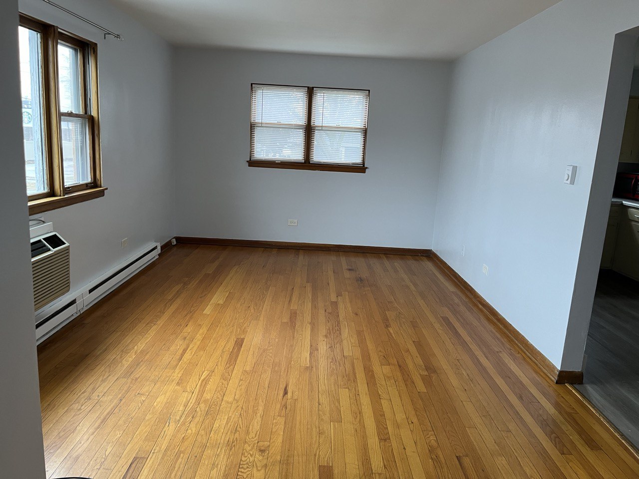 2415 Thornton Lansing Road, Unit 1 Lansing, IL 60438 - Photo 2 of 7 a view of a room with wooden floor and window