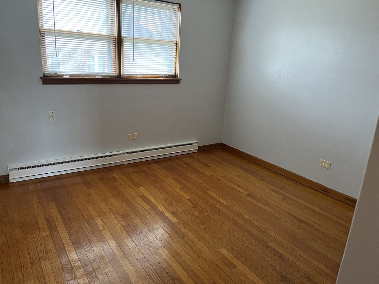 2415 Thornton Lansing Road, Unit 1 Lansing, IL 60438 - Photo 3 of 7 an empty room with a window