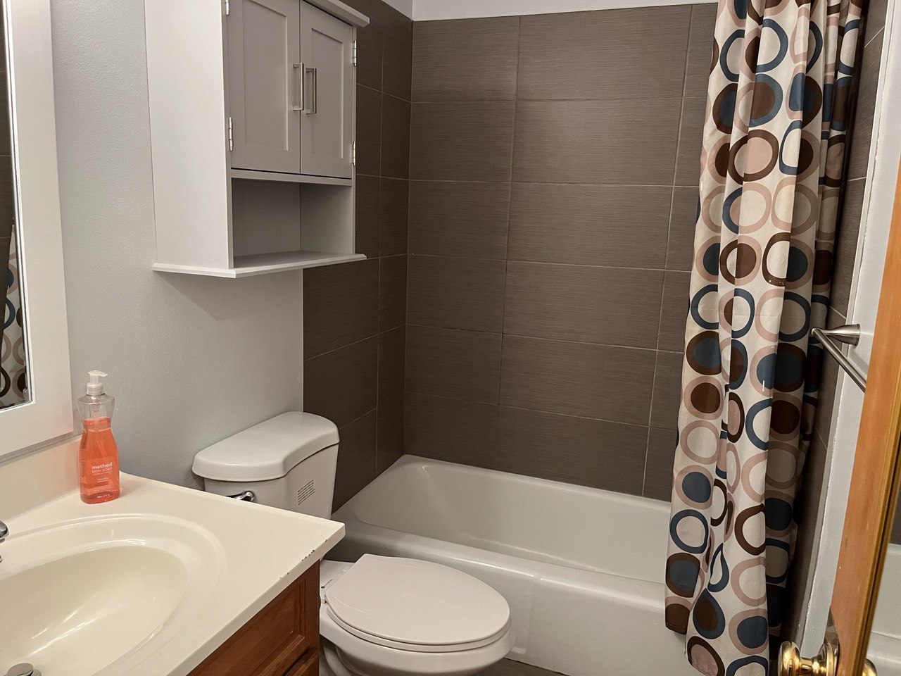 2415 Thornton Lansing Road, Unit 1 Lansing, IL 60438 - Photo 7 of 7 a white toilet sitting next to a bathroom sink