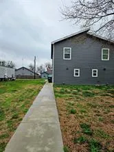 a brick house with a yard