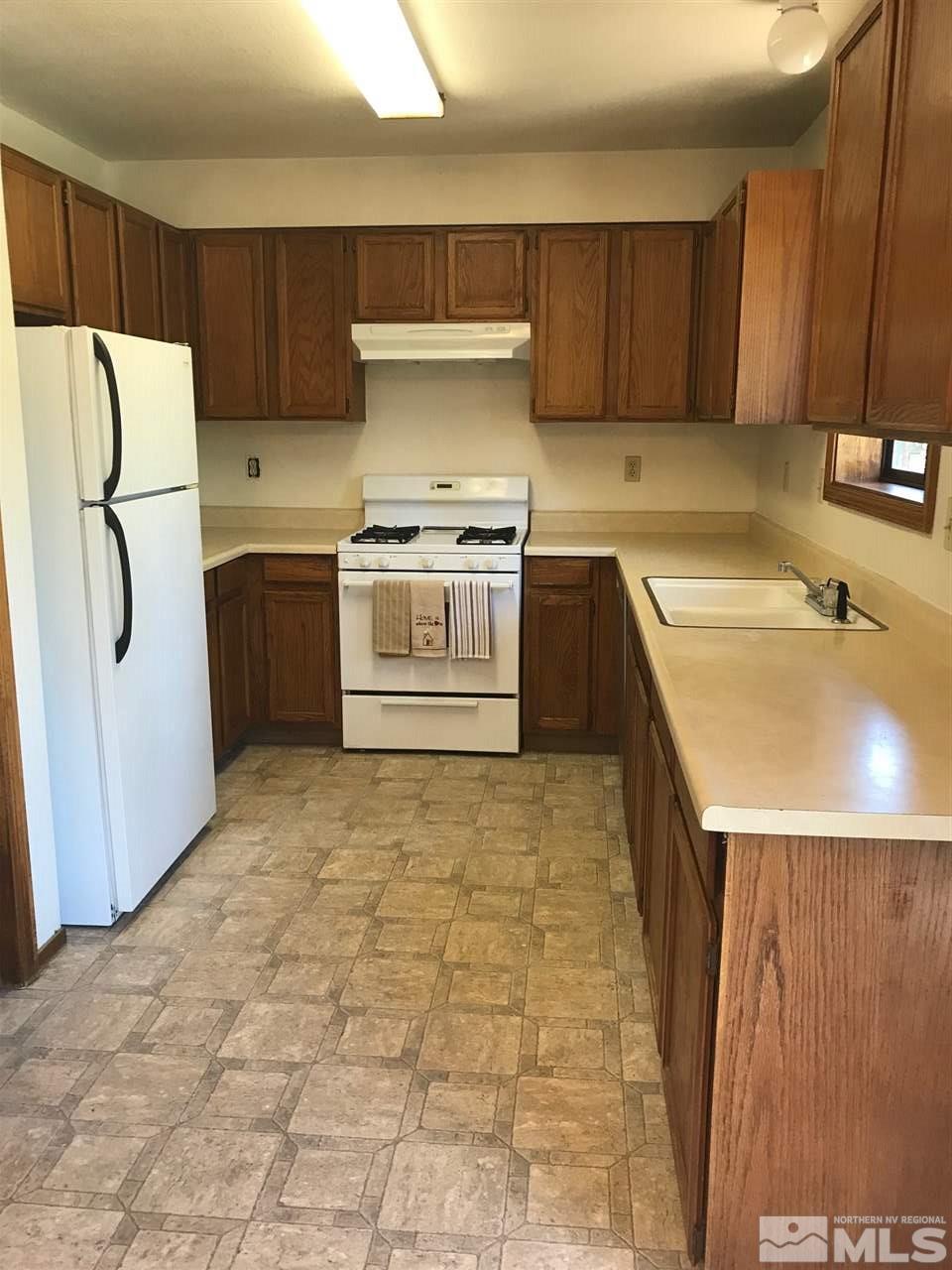 60 Lava Cap Markleeville, CA 96120 - Photo 7 of 20 a kitchen with granite countertop a refrigerator sink stove and cabinets