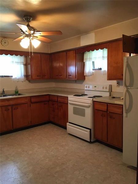 60 Superior Road Tarentum, PA 15084 - Photo 3 of 9 LARGE EAT IN KITCHEN WITH GOOD WOOD CABINETRY. STOVE AND REFRIGERATOR STAY WITH HOME!