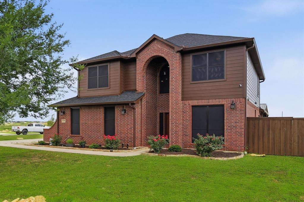 430 Ridgecrest Place Sanger, TX 76266 - Photo 40 of 40 Two-story brick and siding facade with an arched entryway