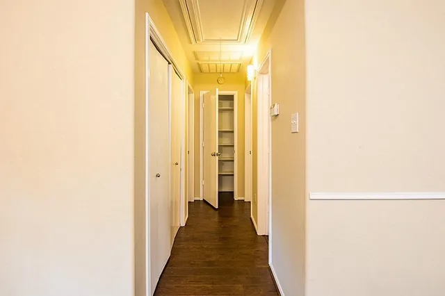 a view of a bathroom from a hallway