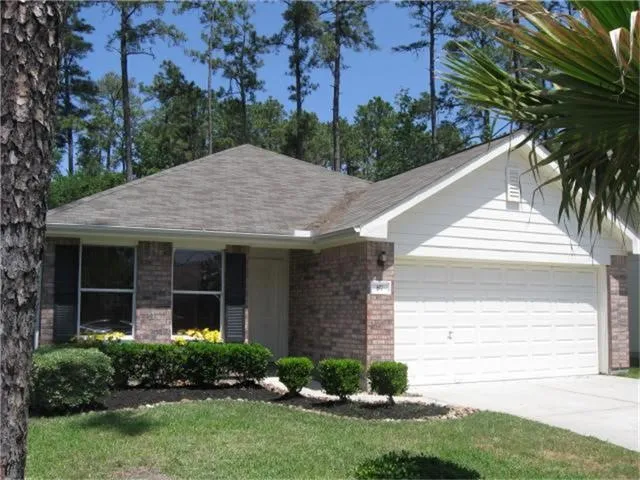 a view of a house with a yard and plants