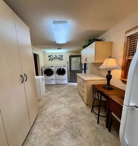 a view of a kitchen with furniture and a fireplace