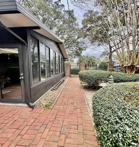 a view of a pathway both side of house