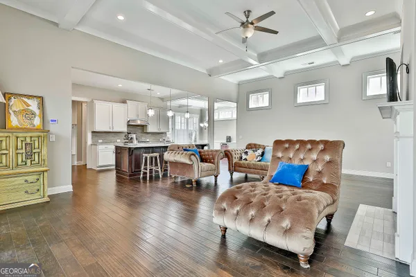 a kitchen with stainless steel appliances granite countertop a sink stove and cabinets