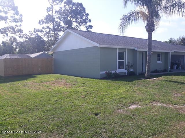 5401 Flint Road Cocoa, FL 32927 - Photo 13 of 13 a front view of house with yard and tress